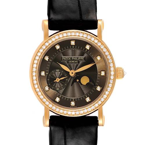 The image shows a frontal view of a Patek Philippe Calatrava 4858J - 010 Women's Yellow Gold Brown Dial 4858J - 010 Women's Yellow Gold Brown Dial watch with a black leather strap and diamond-studded bezel.