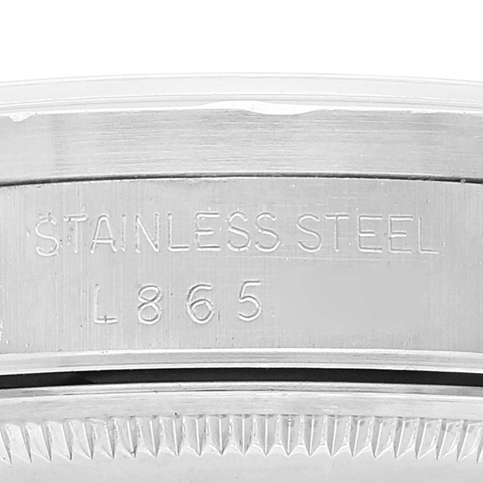 This image shows a close-up of the stainless steel case and model engraving of a Rolex Date 15210 Men's Stainless Steel Silver Dial 15210 Men's Stainless Steel Silver Dial watch.