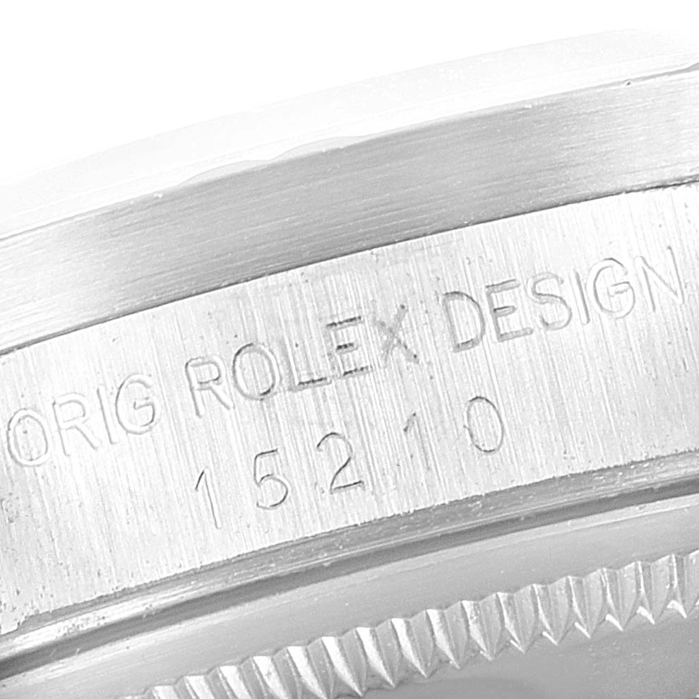 This image shows a close-up of the case side engraving with "ORIG ROLEX DESIGN" on a Rolex Date 15210 Men's Stainless Steel Silver Dial 15210 Men's Stainless Steel Silver Dial model watch.