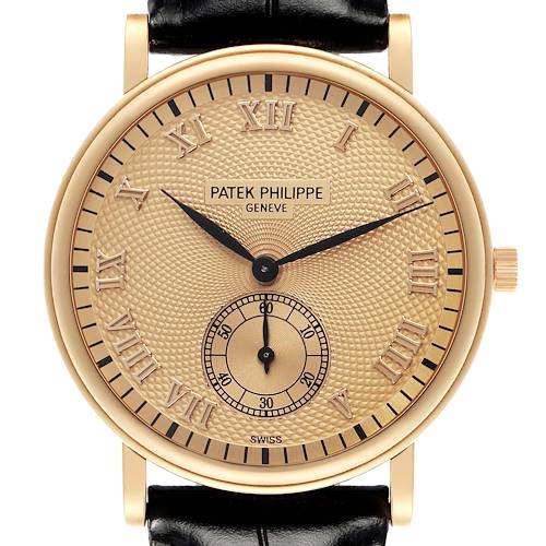 The image shows a frontal view of the Patek Philippe Calatrava model 5022J-001, highlighting the gold case, Roman numerals, and subdial on the textured dial.