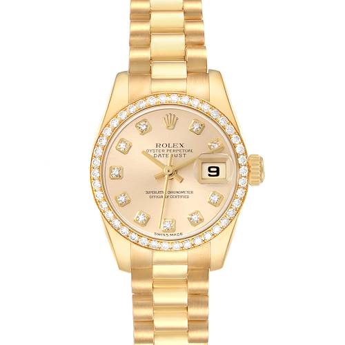 The Rolex President model number 179138 is shown from a top-down angle, displaying the face, bezel, bracelet, and crown, highlighting its gold tone and diamond markers.
