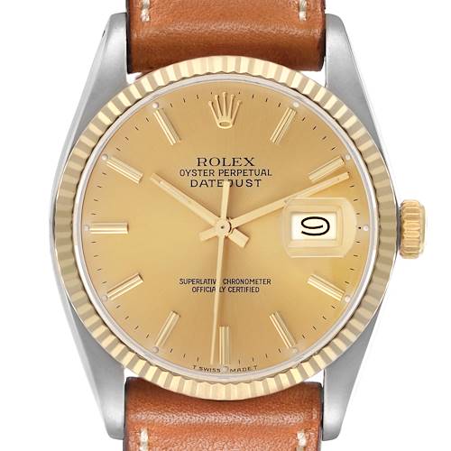 The Rolex Vintage Collection model 16013 is shown from the front, displaying the gold dial, fluted bezel, and date window, with a brown leather strap attached.