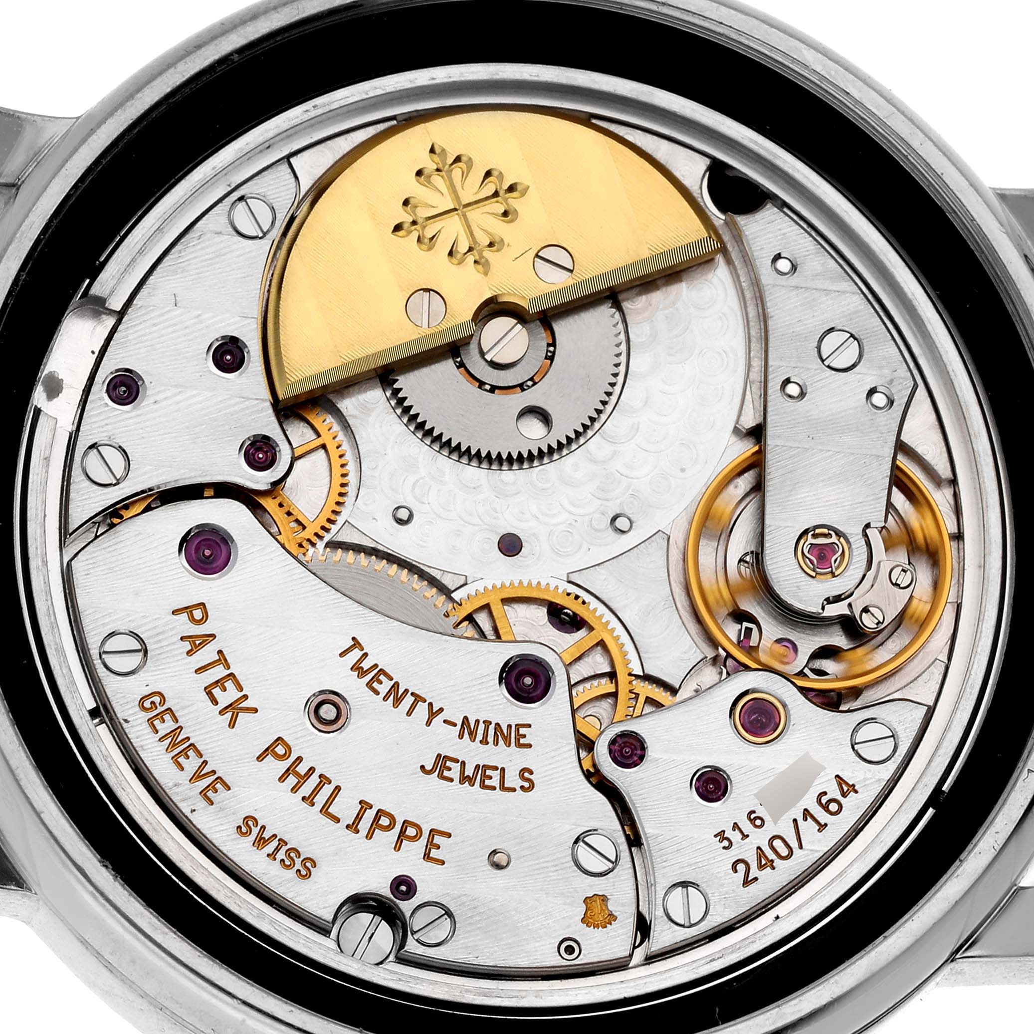 This image shows the back view of the Patek Philippe Complications 5055G-010 Men's White Gold Black Dial 5055G-010 Men's White Gold Black Dial watch, displaying its intricate inner mechanical movements and parts.