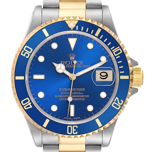 The Rolex Submariner model 16613 is shown from a frontal angle, highlighting the blue dial, gold and blue bezel, hour markers, date window, and the two-tone bracelet.