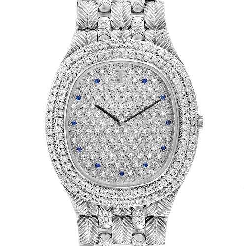 This vintage Audemars Piguet watch is shown from a top-down angle, displaying its diamond-encrusted face and metallic band.