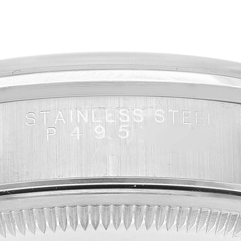 The image shows a close-up of the stainless steel case back edge with engraved text from a Rolex Date 15200 Men's Stainless Steel Black Dial 15200 Men's Stainless Steel Black Dial model watch.
