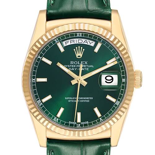 The image shows a frontal view of the Rolex President model 118138 men's watch, featuring a green dial, day and date display, gold fluted bezel, and a green strap.