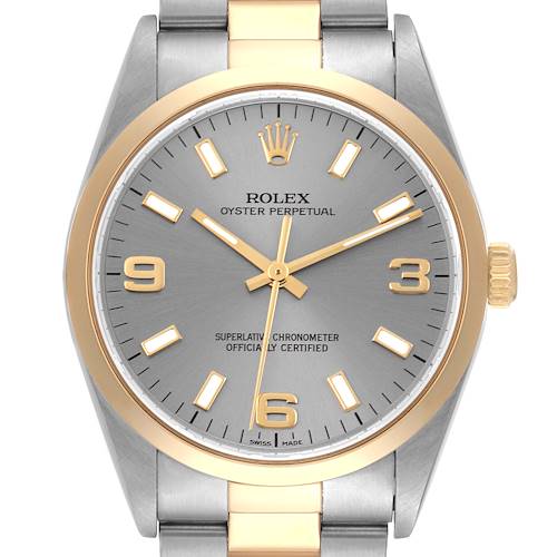 The image shows a front view of the Rolex Oyster Perpetual 14203 Men's Steel and Gold (two tone) Grey Dial 14203 Men's Steel and Gold (two tone) Grey Dial watch, highlighting its face, markers, bezel, crown, and part of the bracelet.