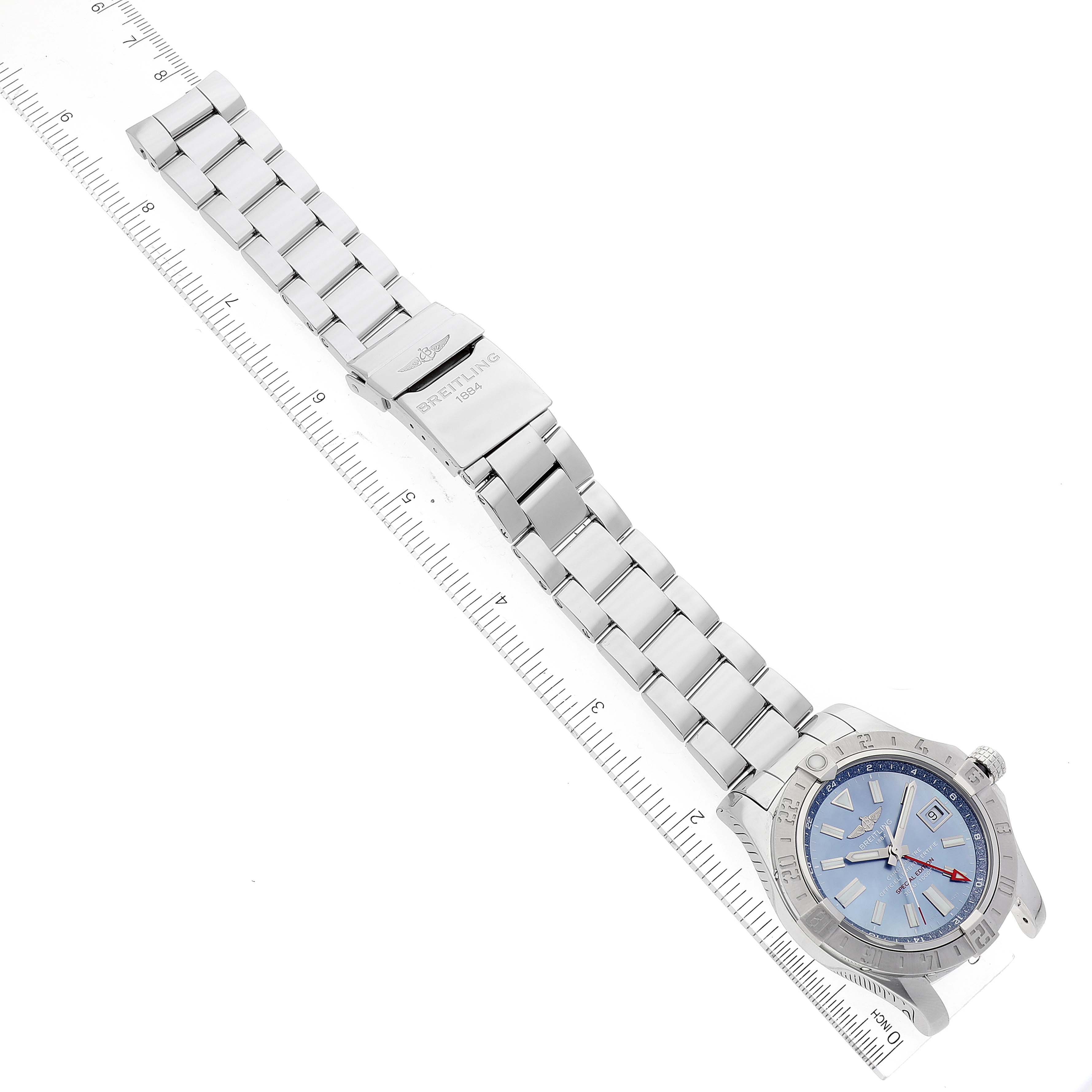 The image shows a top-down angle of a Breitling Avenger A3239011-C872-170A Men's Stainless Steel Mother of Pearl Dial A3239011-C872-170A Men's Stainless Steel Mother of Pearl Dial watch, displaying the bracelet and part of the case with a blue dial.