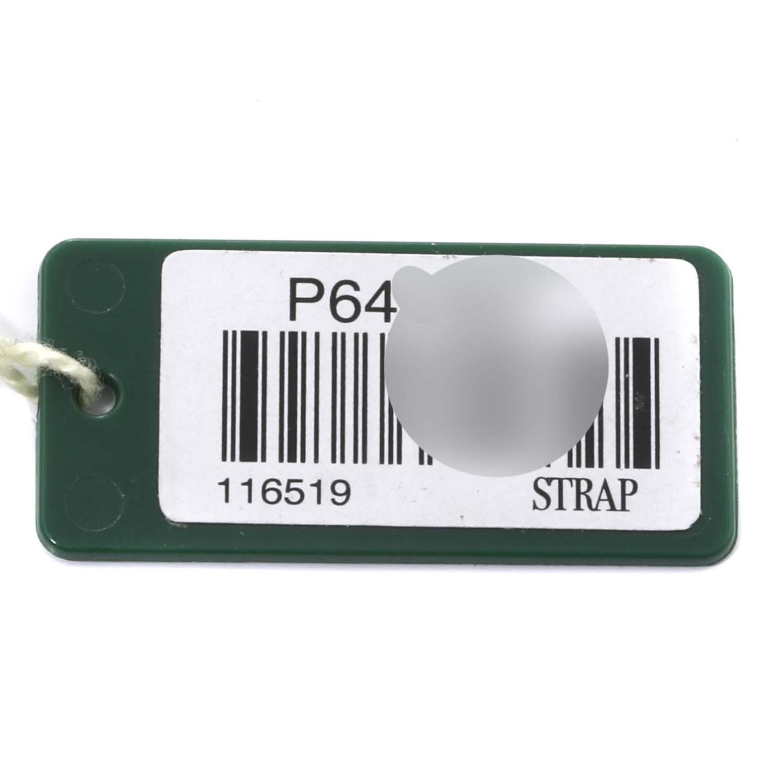 This is a Rolex Daytona 116519 Men's White Gold Black Dial 116519 Men's White Gold Black Dial model watch tag showing a barcode and serial number at a top-down angle.