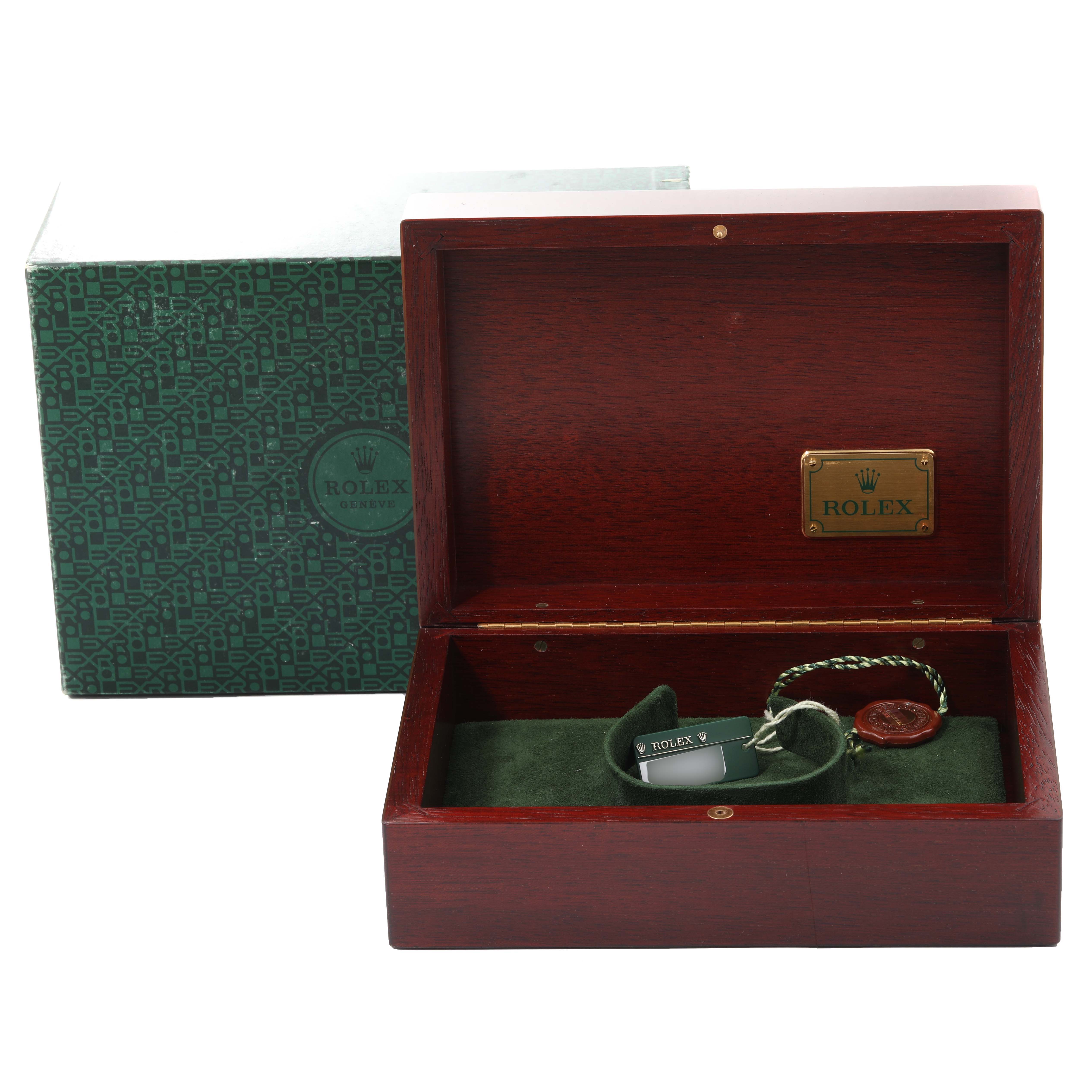 The image shows an open Rolex Daytona 116519 Men's White Gold Black Dial 116519 Men's White Gold Black Dial watch box with its accessories and the outer packaging in view.