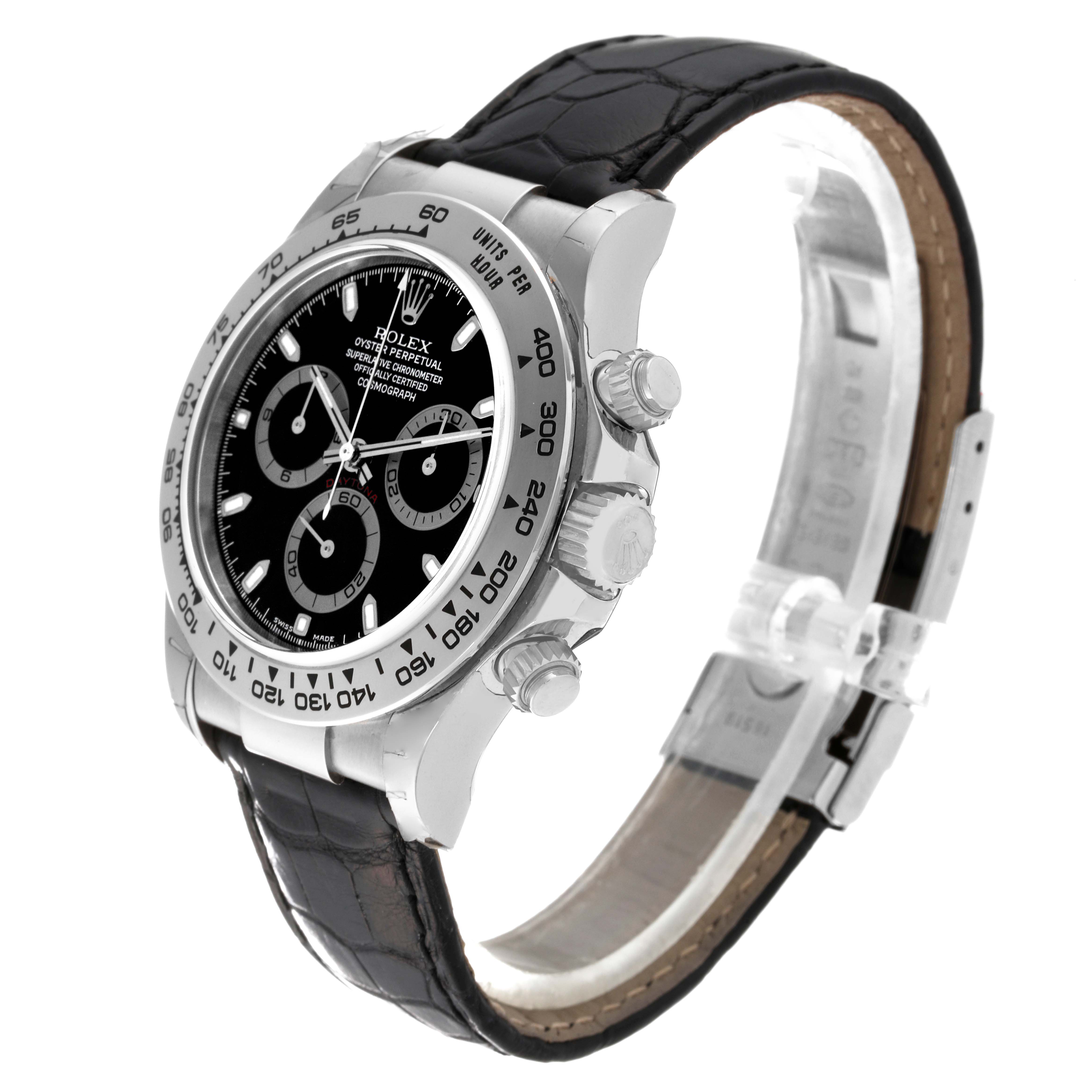 The Rolex Daytona 116519 Men's White Gold Black Dial 116519 Men's White Gold Black Dial watch is shown at a slight angle, highlighting its face, bezel, pushers, crown, and leather strap.