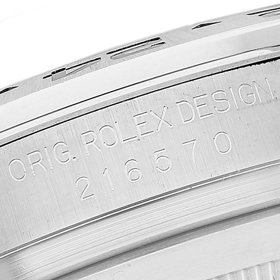 The image shows the side of the case of a Rolex Explorer 216570 Men's Stainless Steel White Dial 216570 Men's Stainless Steel White Dial model, displaying the engraved reference number 216570.