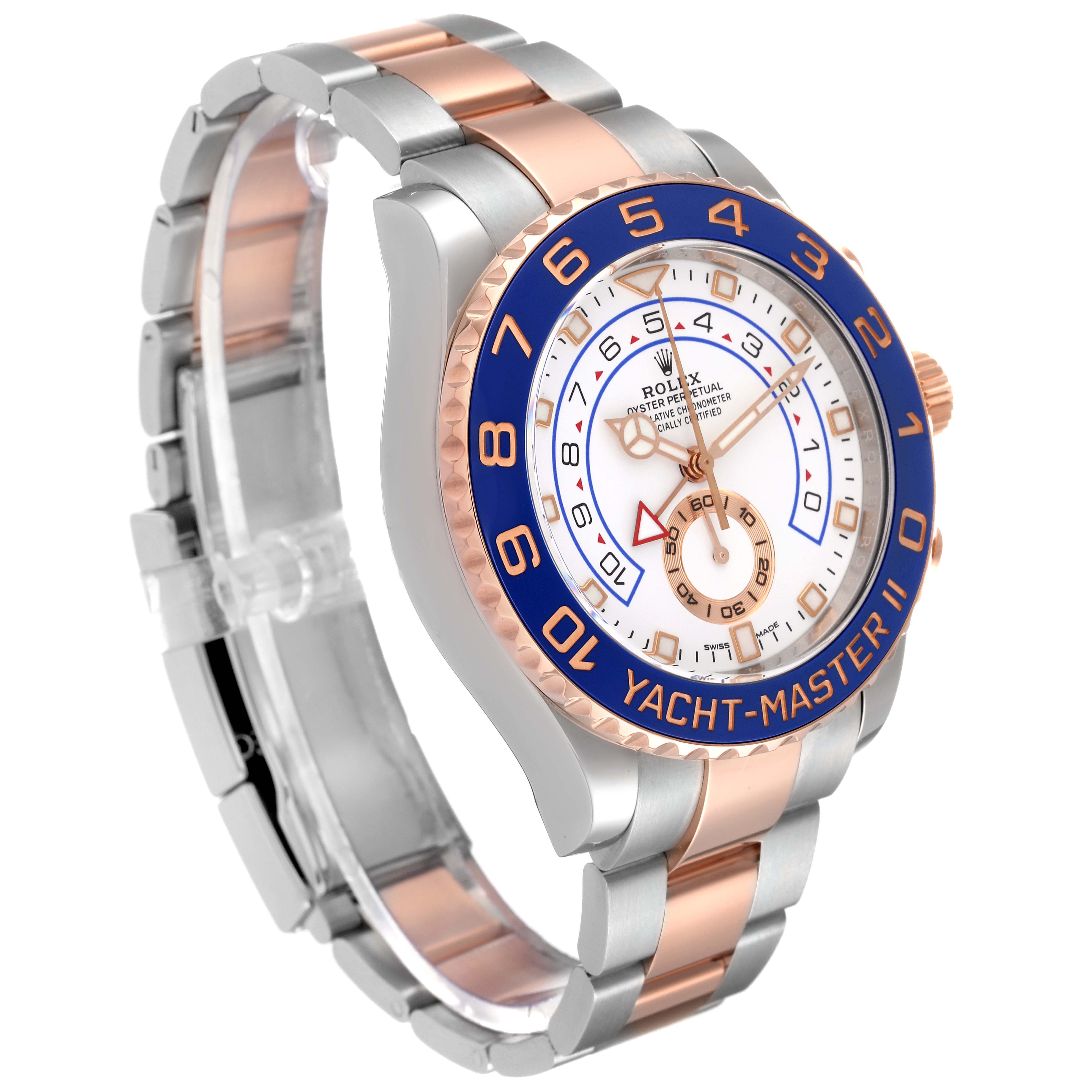 The image shows a Rolex Yacht-Master 116681 Men's Steel and Gold (two tone) White Dial 116681 Men's Steel and Gold (two tone) White Dial watch at a left angle, highlighting its two-tone bracelet, blue bezel, and white dial.