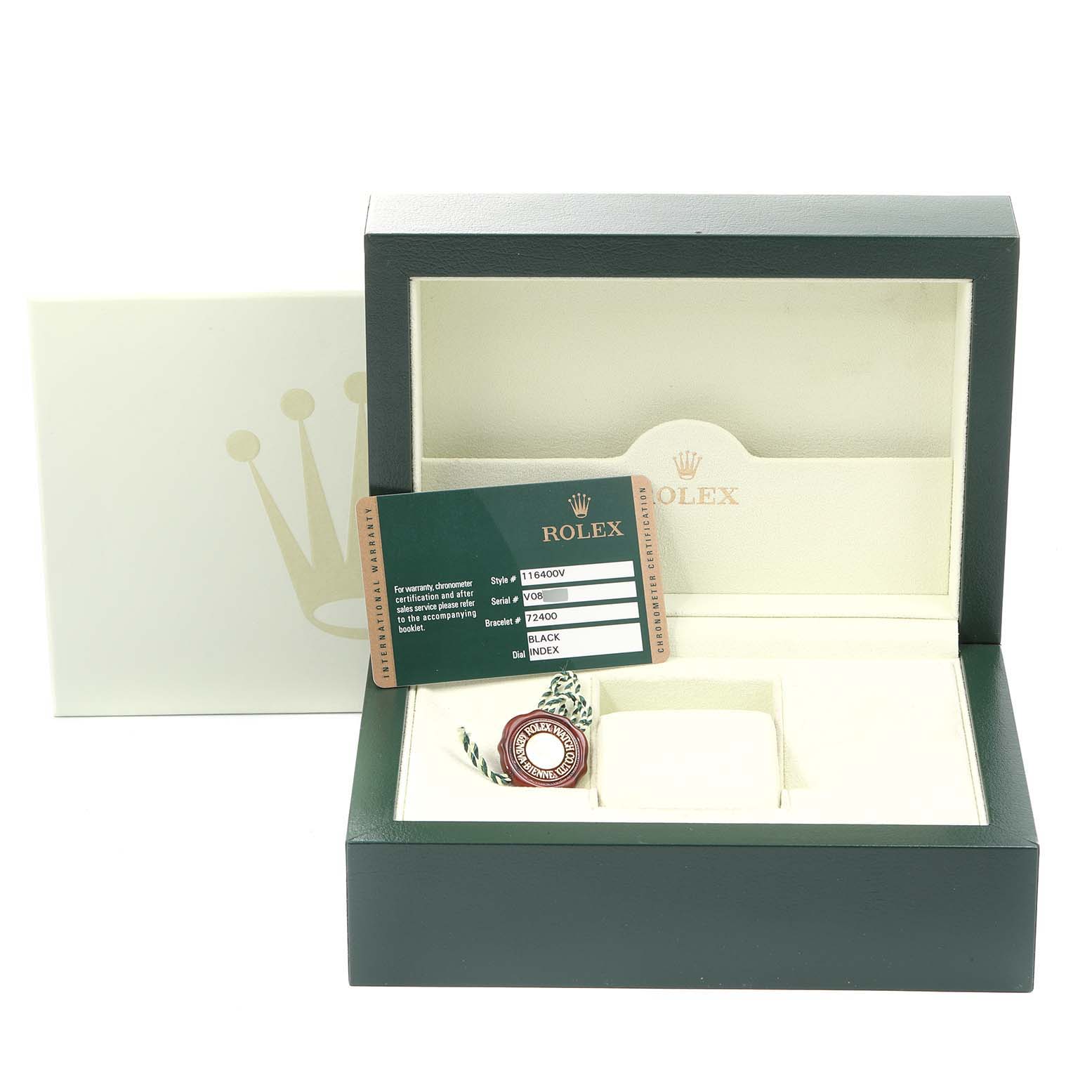 The image shows a Rolex Milgauss 116400GV Men's Stainless Steel Black Dial 116400GV Men's Stainless Steel Black Dial watch box with its certification card and tag, with the box open and empty.