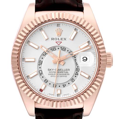 The image shows a Rolex Sky-Dweller model 326135 watch from the front, highlighting its face, bezel, and crown with a focus on the dial and date display.