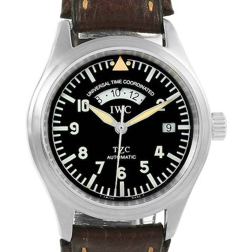 The image shows a frontal view of the Pilot model watch by IWC, featuring its dial, bezel, crown, and leather strap.