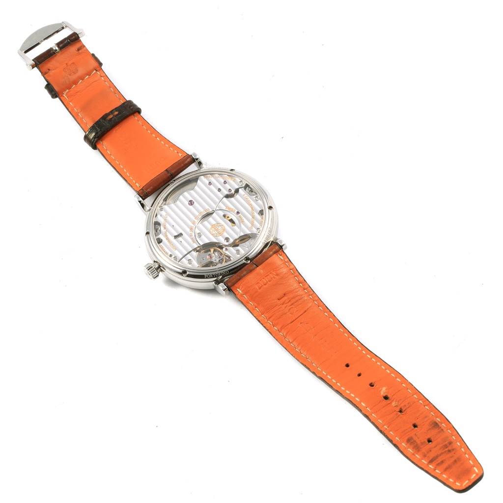 The image shows the back view of the IWC Portofino IW510106 Men's Stainless Steel Blue Dial IW510106 Men's Stainless Steel Blue Dial watch, highlighting its orange leather strap and exhibition case back.