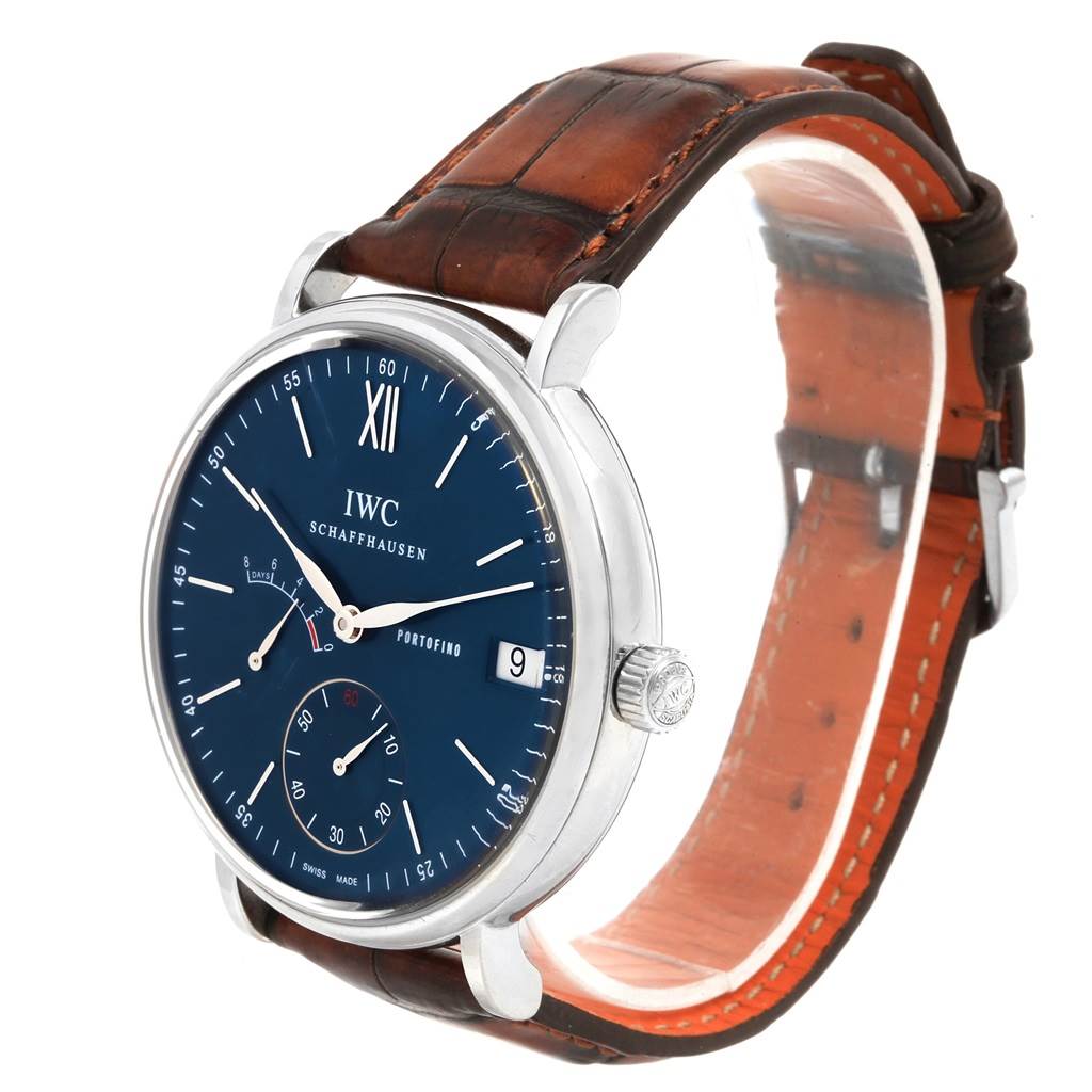 The IWC Portofino IW510106 Men's Stainless Steel Blue Dial IW510106 Men's Stainless Steel Blue Dial watch is shown at a three-quarter angle, displaying the face, dial, crown, and leather strap.