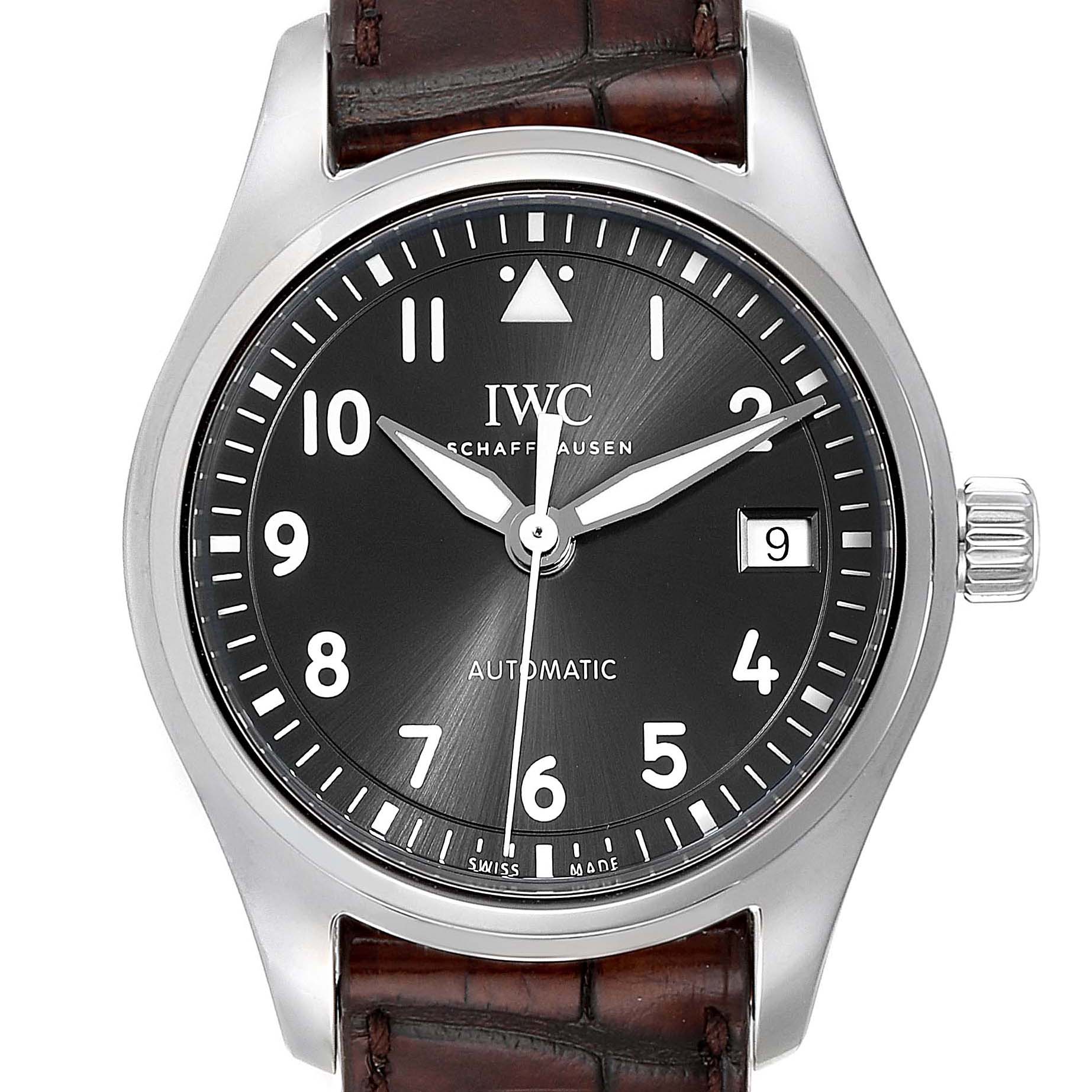 This image shows the full face of an IWC Pilot 5524G Men's Stainless Steel Grey Dial 5524G Men's Stainless Steel Grey Dial model watch, displaying its dial, hands, crown, and part of its leather strap.