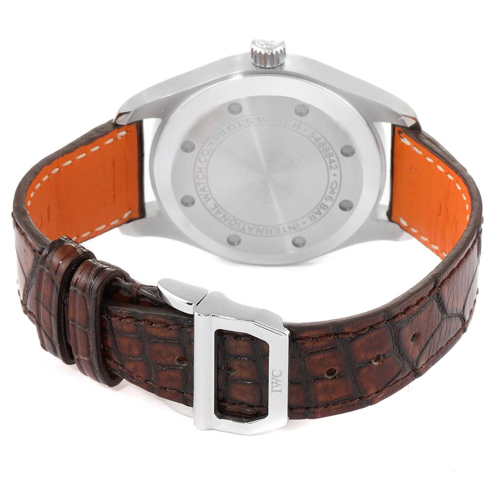 The image shows the back view of the IWC Pilot 5524G Men's Stainless Steel Grey Dial 5524G Men's Stainless Steel Grey Dial model watch, focusing on the case back, crown, and brown leather strap with a silver buckle.