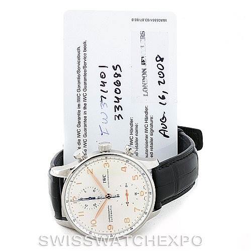 The image shows an IWC Portuguese IW371401 Men's Stainless Steel Silver Dial IW371401 Men's Stainless Steel Silver Dial model watch with a black leather strap and warranty card from a front angle.