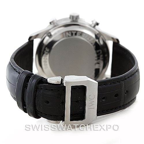 The image shows the back of the IWC Portuguese IW371401 Men's Stainless Steel Silver Dial IW371401 Men's Stainless Steel Silver Dial watch and its clasp on a black leather strap.