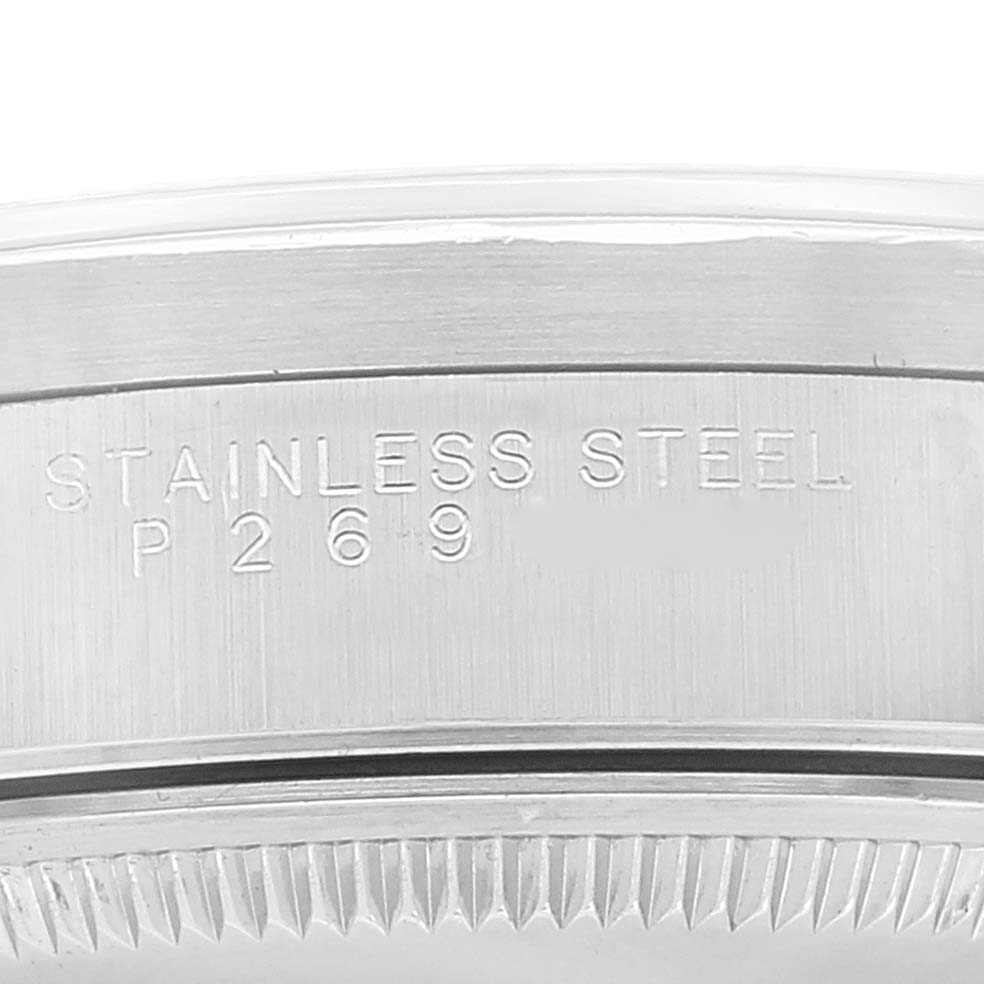 This image shows a close-up view of the side and engraved serial number of a Rolex Date 15210 Men's Stainless Steel White Dial 15210 Men's Stainless Steel White Dial model watch case.