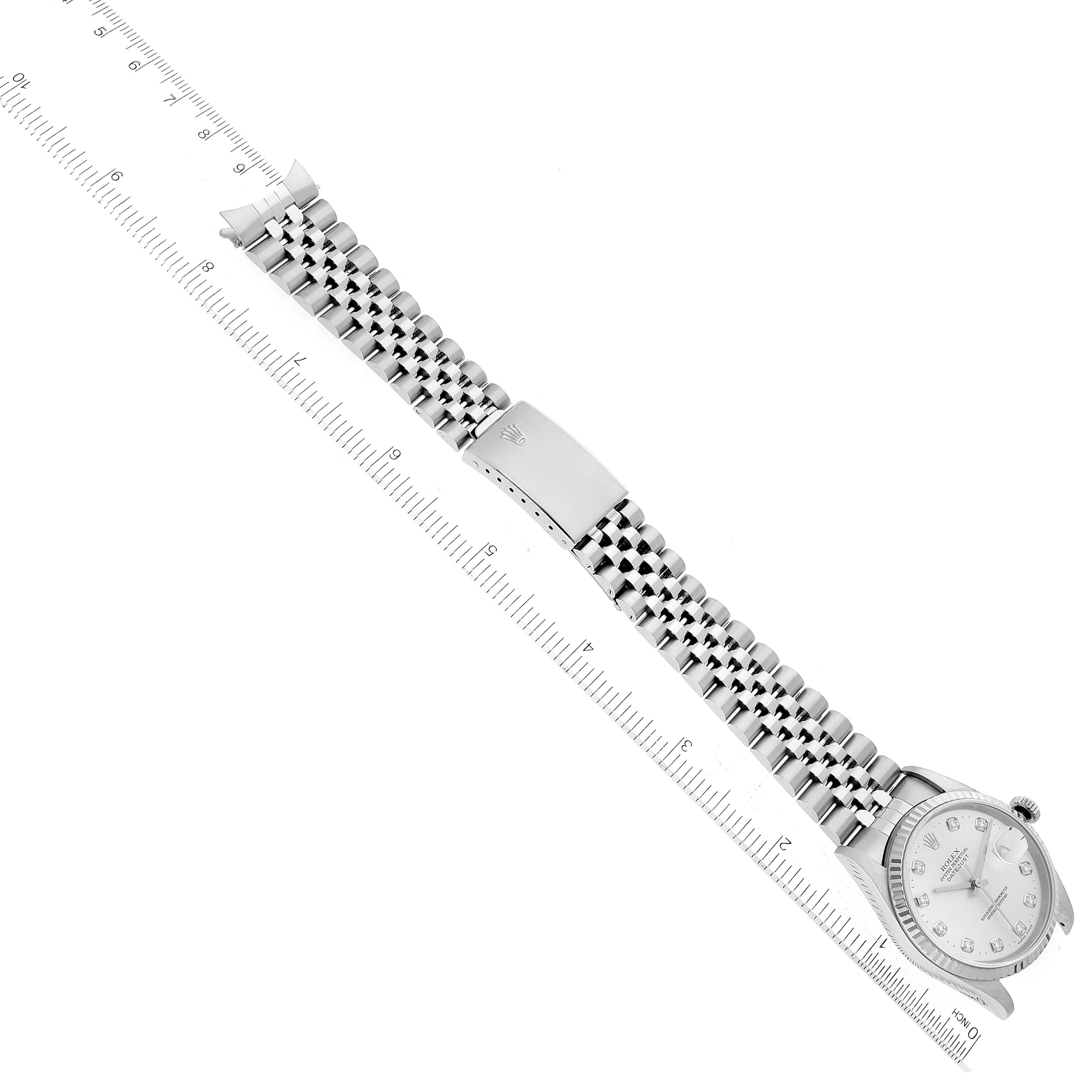 The image shows a Rolex Datejust 16234 Men's Stainless Steel Silver Dial 16234 Men's Stainless Steel Silver Dial watch at a diagonal angle, highlighting its bracelet and clasp against a measuring ruler.