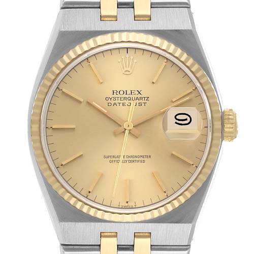 The image shows a front view of a Rolex Oysterquartz 17013 Men's Steel and Gold (two tone) Champagne Dial 17013 Men's Steel and Gold (two tone) Champagne Dial Datejust watch, highlighting its dial, bezel, and part of the bracelet.
