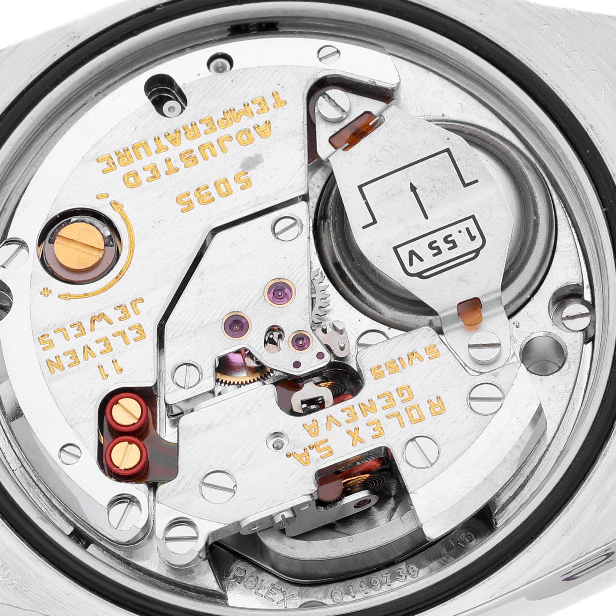 The image shows a close-up of the internal movement mechanism of a Rolex Oysterquartz 17013 Men's Steel and Gold (two tone) Champagne Dial 17013 Men's Steel and Gold (two tone) Champagne Dial watch, detailing gears, circuits, and the battery.