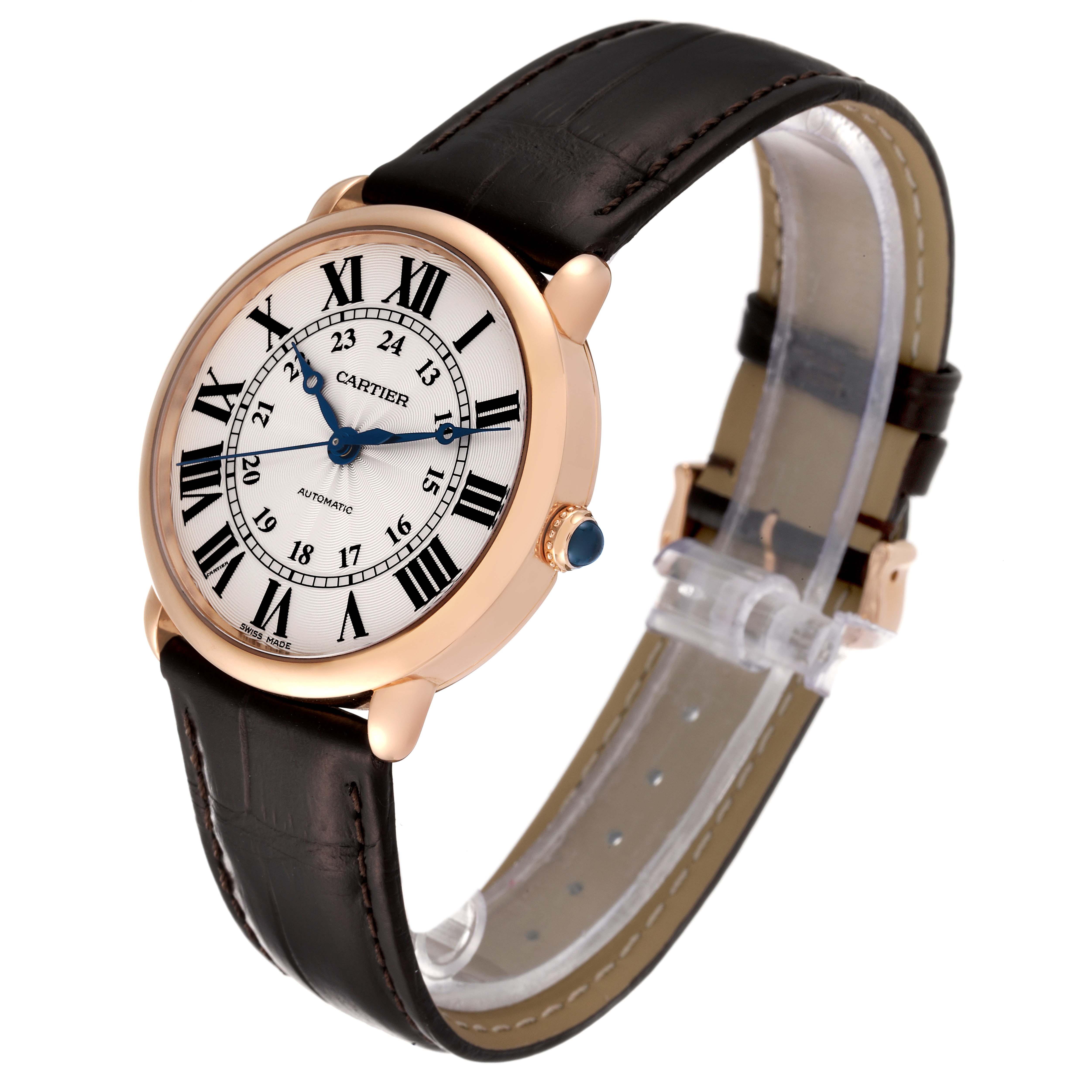 The watch is shown at a three-quarter angle, displaying the face, Roman numerals, and leather strap.