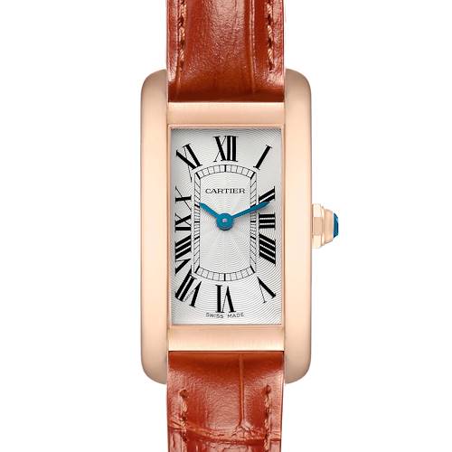 The Cartier Tank Americaine W2607456 Women's Rose Gold Silver Dial watch is shown from a front angle, displaying its rectangular face, Roman numerals, and leather strap.