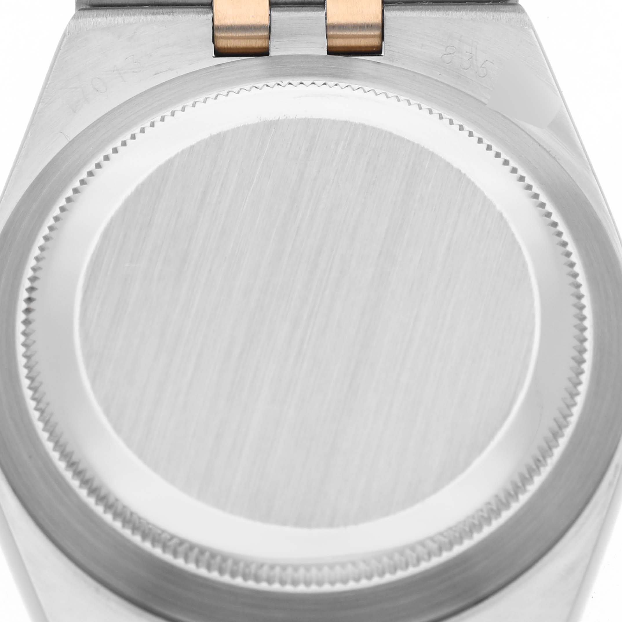 The image shows the case back of a Rolex Oysterquartz 17013 Men's Steel and Gold (two tone) Silver Dial 17013 Men's Steel and Gold (two tone) Silver Dial watch from a top-down perspective.