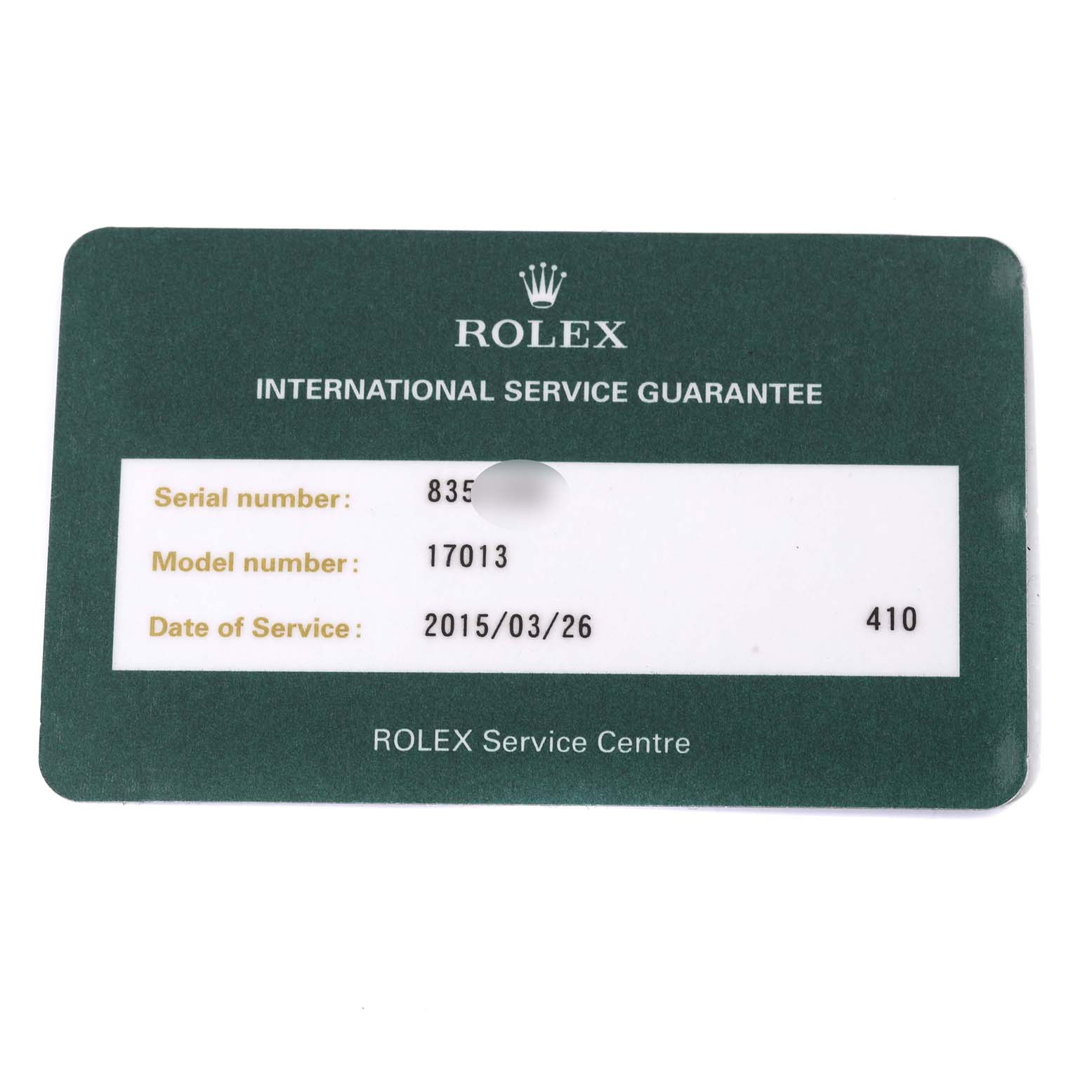 The image shows an international service guarantee card from Rolex for the Oysterquartz model.
