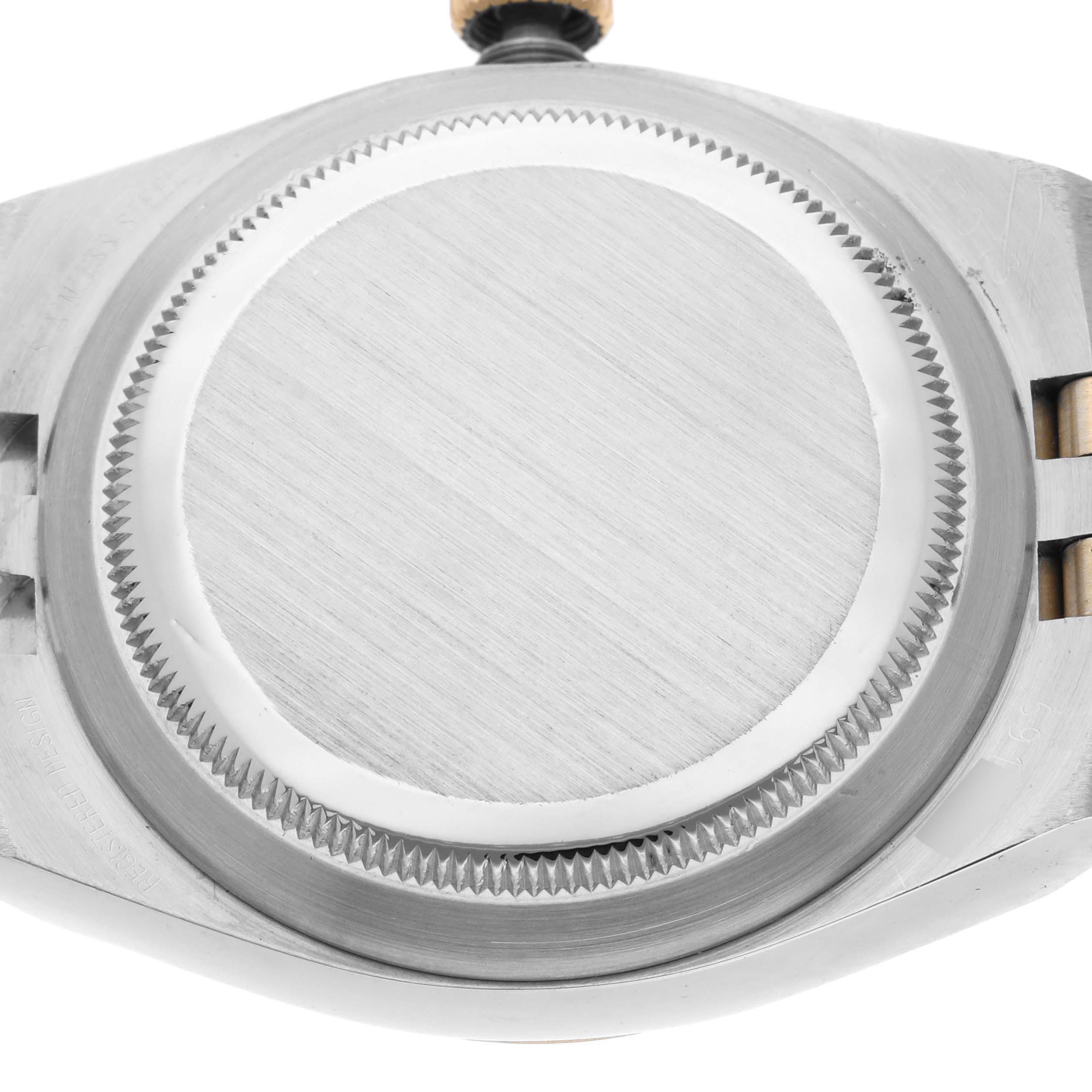 The image shows the case back and crown of a Rolex Oysterquartz 17013 Men's Steel and Gold (two tone) White Dial 17013 Men's Steel and Gold (two tone) White Dial watch from a top-down perspective.