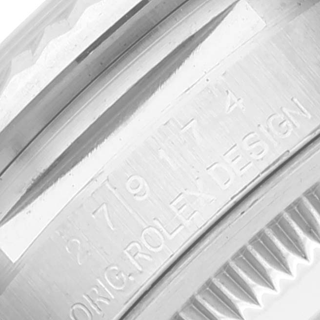 This close-up shows the engraved serial number and "ORIG ROLEX DESIGN" on the side of the case of a Rolex Datejust 279174 Women's Stainless Steel Mother of Pearl Dial 279174 Women's Stainless Steel Mother of Pearl Dial watch.