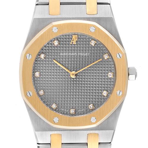 The image shows a front view of an Audemars Piguet Royal Oak 56303SA Men's Steel and Gold (two tone) Grey Dial 56303SA Men's Steel and Gold (two tone) Grey Dial watch, highlighting its dial, bezel, and portions of the bracelet.