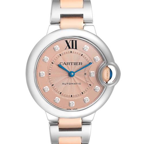 The Cartier Ballon Bleu WE902053 Women's Steel and Gold (two tone) Pink Dial watch is shown from the front, highlighting its dial, hands, crown, and bracelet.