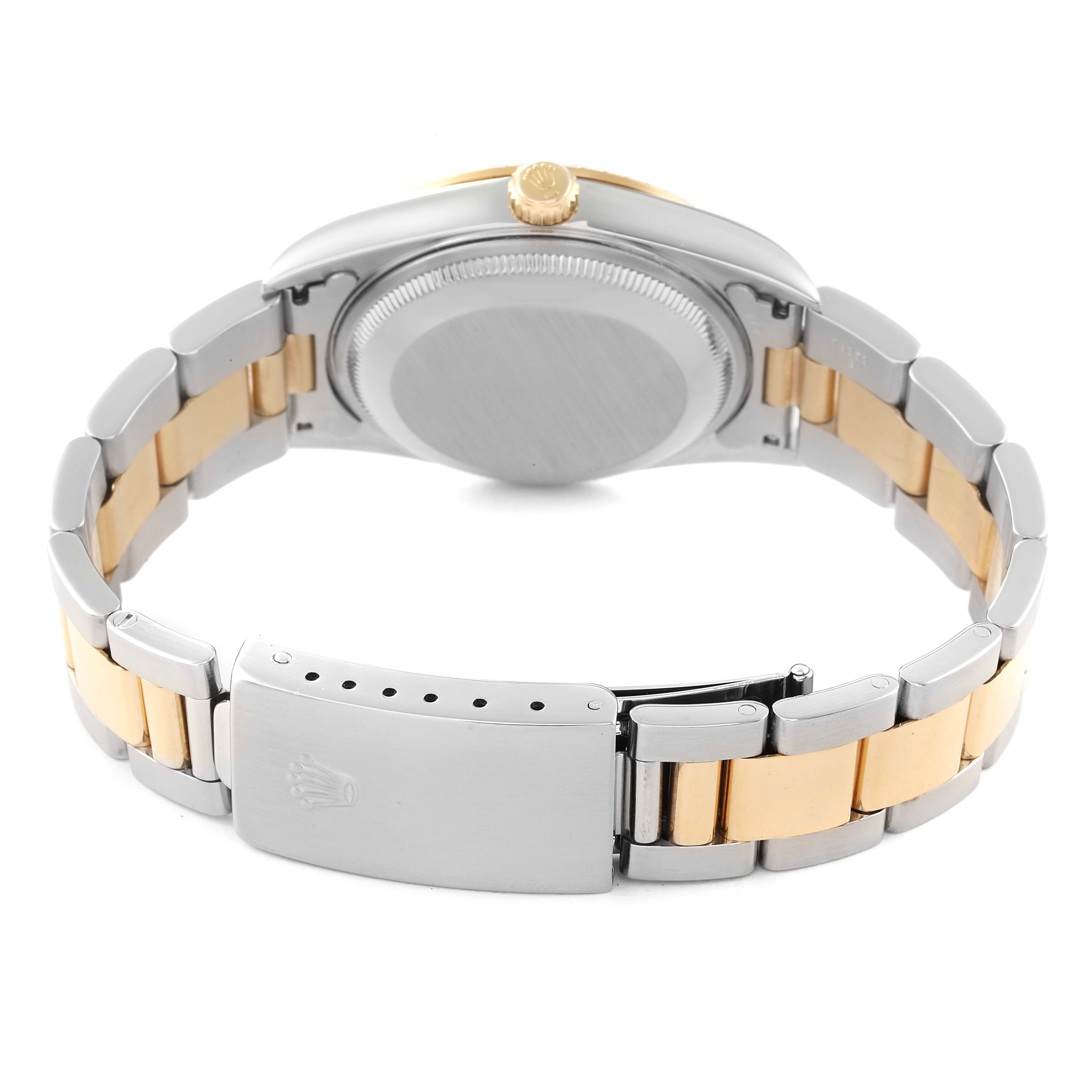 This image shows the back of a Rolex Date 15223 Men's Steel and Gold (two tone) Champagne Dial 15223 Men's Steel and Gold (two tone) Champagne Dial model watch, focusing on the bracelet, clasp, and case back.