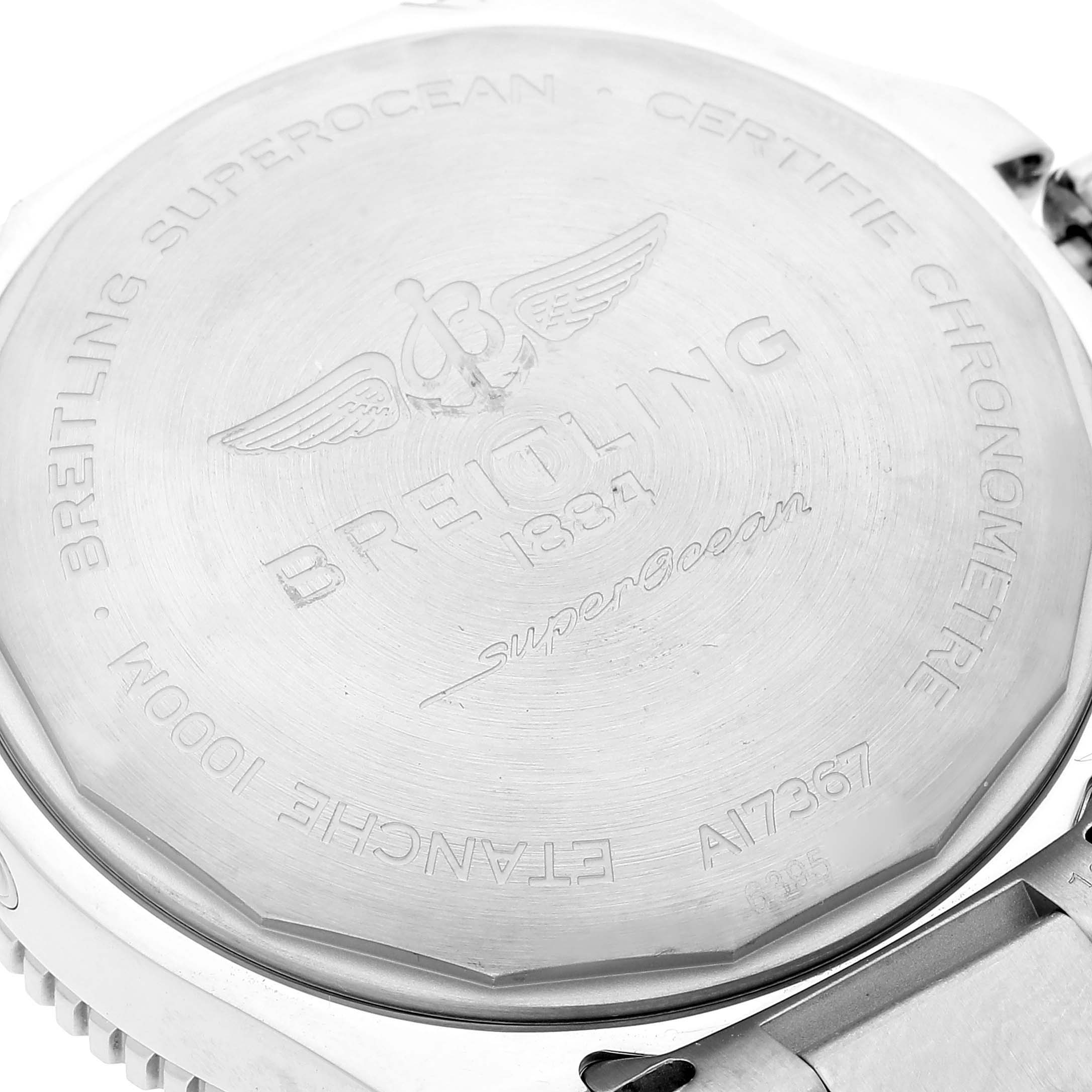 The image shows the back casing of a Breitling Superocean A17367 Men's Stainless Steel Blue Dial A17367 Men's Stainless Steel Blue Dial watch, focusing on the engravings and detailing.