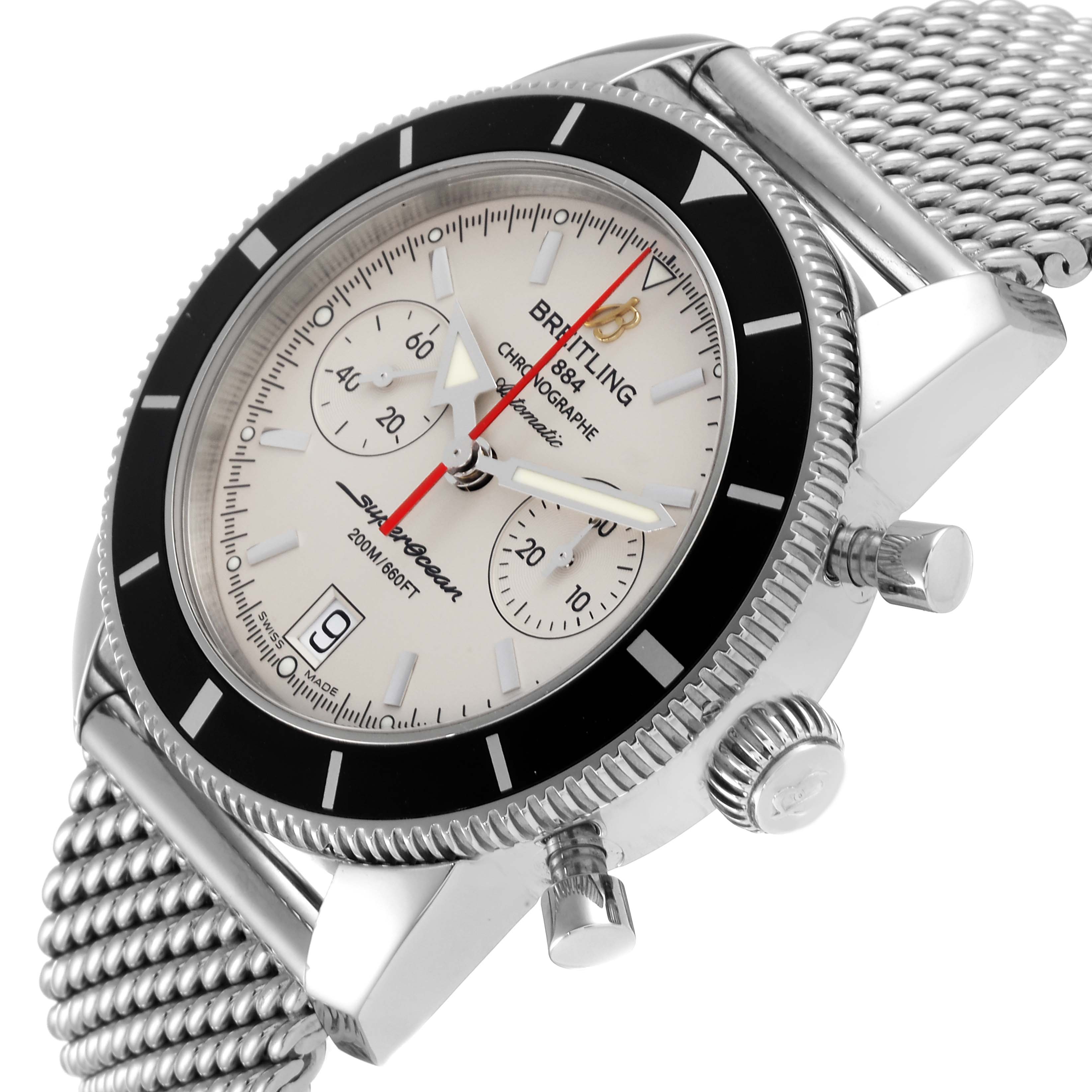 The image shows a Breitling Superocean A23370 Men's Stainless Steel Silver Dial A23370 Men's Stainless Steel Silver Dial watch at an angle, highlighting the face, bezel, crown, and pushers, with a mesh bracelet.