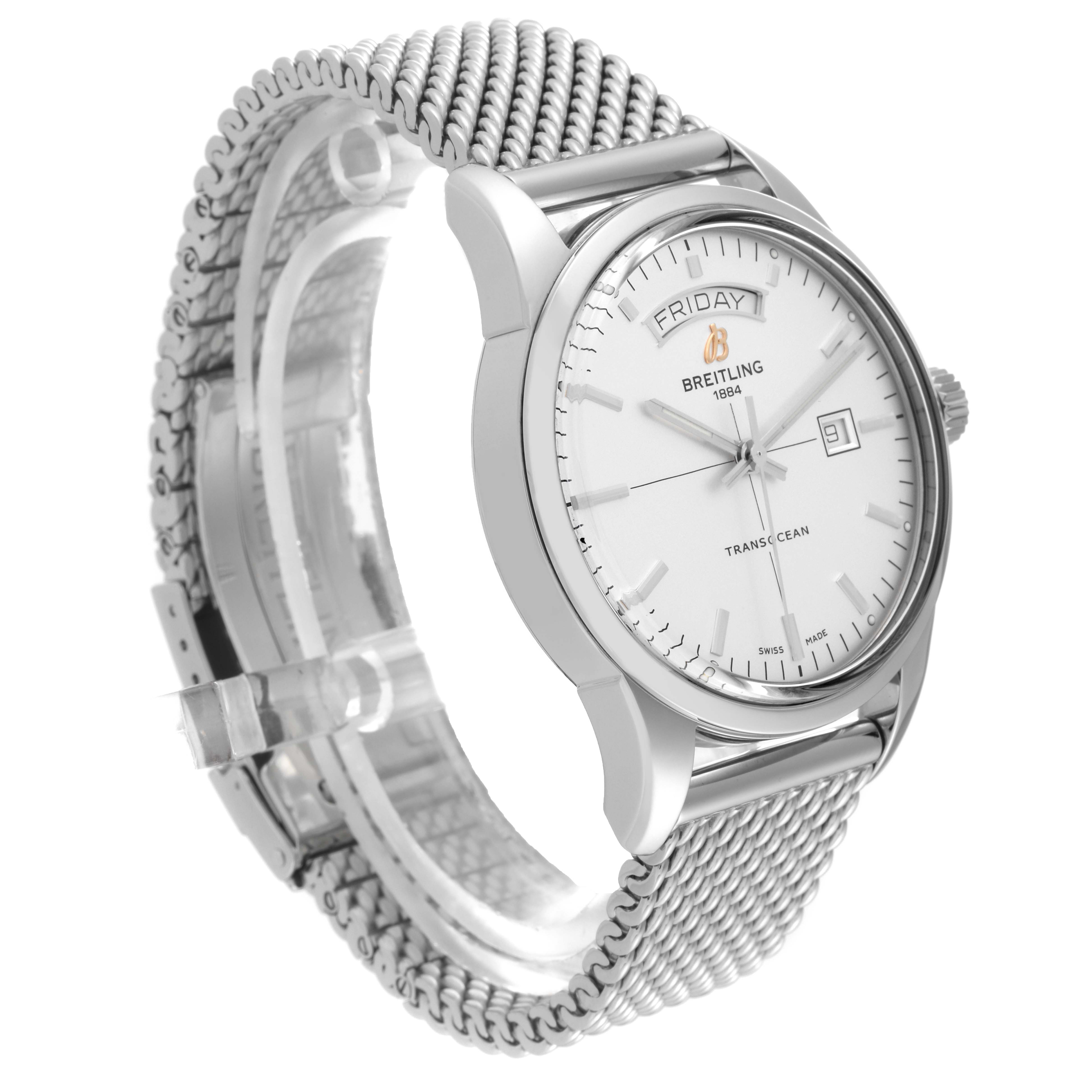 The Transocean model by Breitling is shown at an angled side view, displaying the watch face and mesh bracelet.