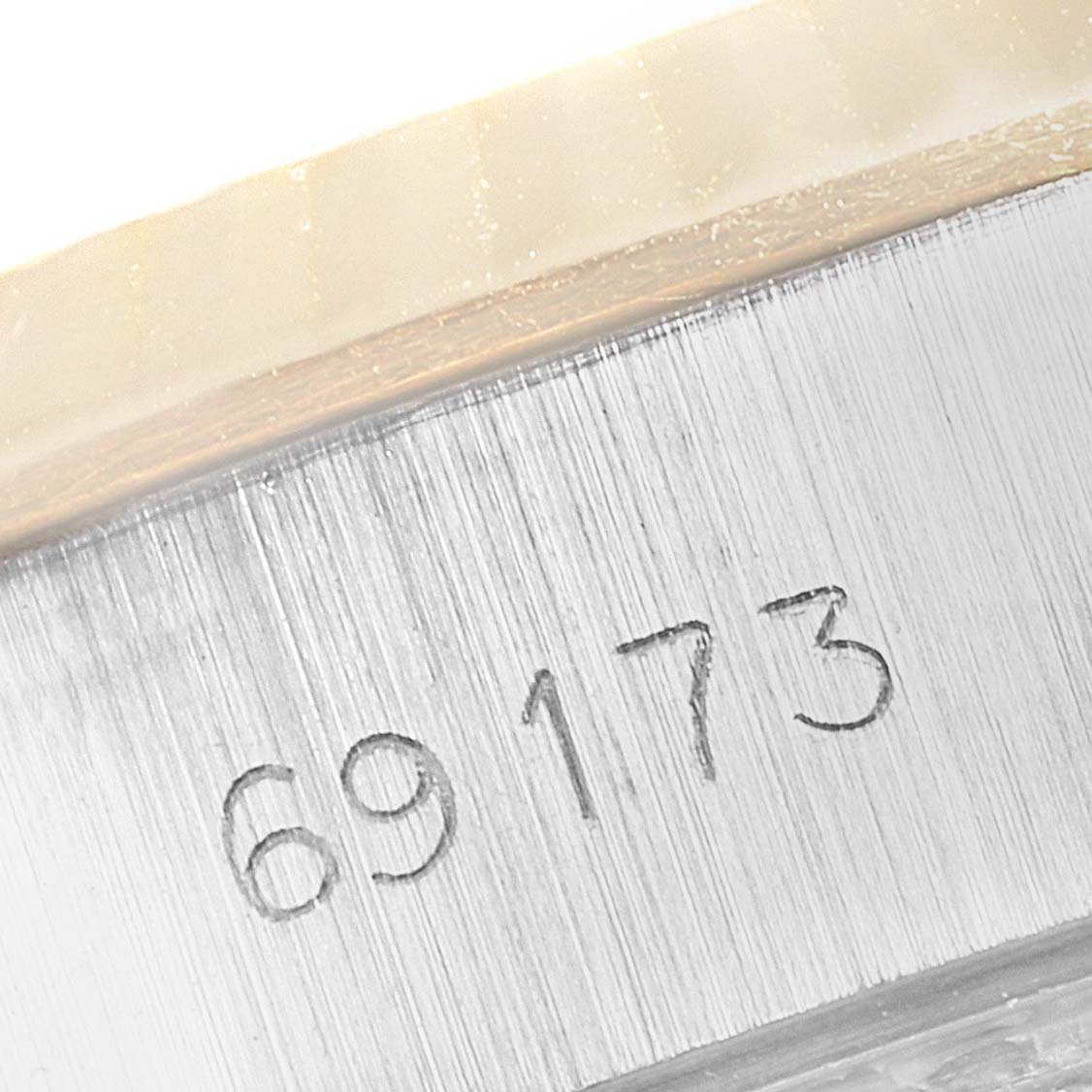 This image shows a close-up of the watch’s case side with the model number "69173" engraved on a Rolex Datejust 69173 Women's Steel and Gold (two tone) Black Dial 69173 Women's Steel and Gold (two tone) Black Dial.