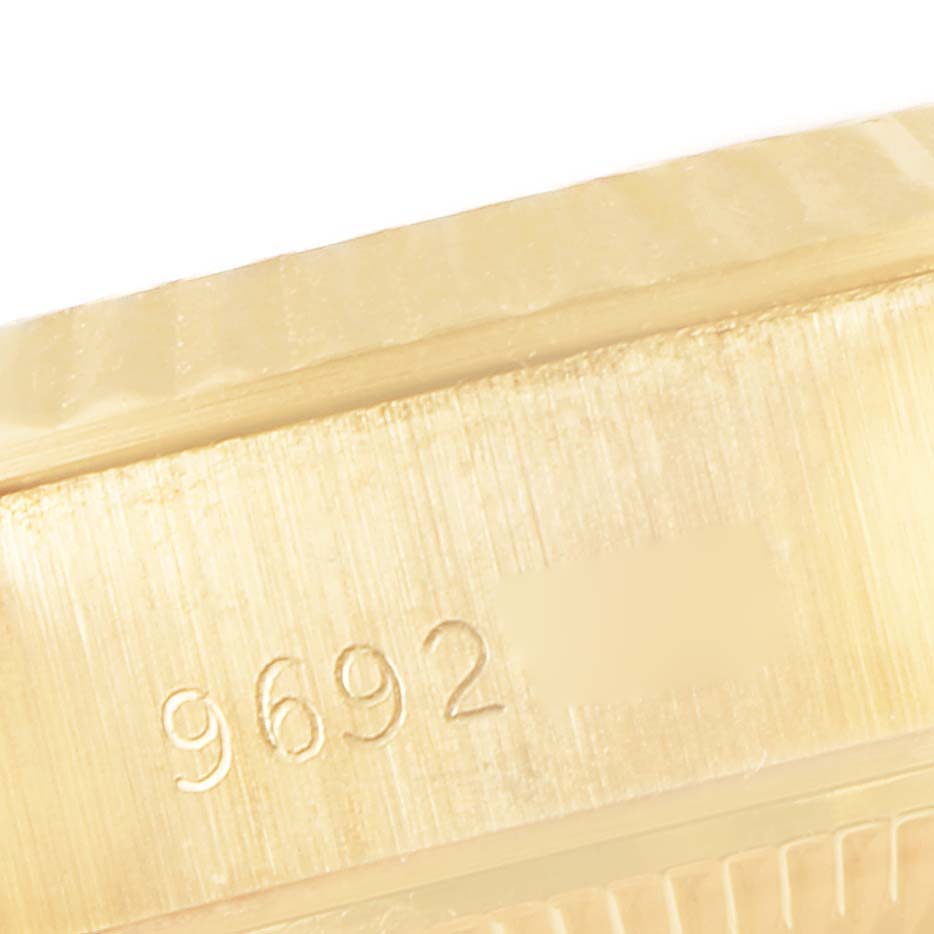 This image shows a close-up of a serial number engraved on the side of a Rolex President 69178 Women's Yellow Gold Champagne Dial 69178 Women's Yellow Gold Champagne Dial model timepiece.