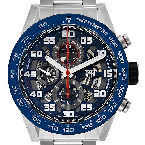The image shows a front view of the Tag Heuer Carrera CAR2A1K.BA0703 Men's Stainless Steel Blue Dial CAR2A1K.BA0703 Men's Stainless Steel Blue Dial watch, highlighting its skeleton dial and tachymeter bezel.