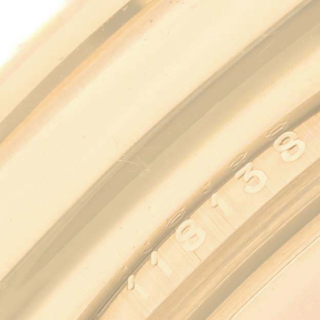 This image shows a close-up of the engraved case back of a Rolex President 118138 Men's Yellow Gold Green Dial 118138 Men's Yellow Gold Green Dial model watch.