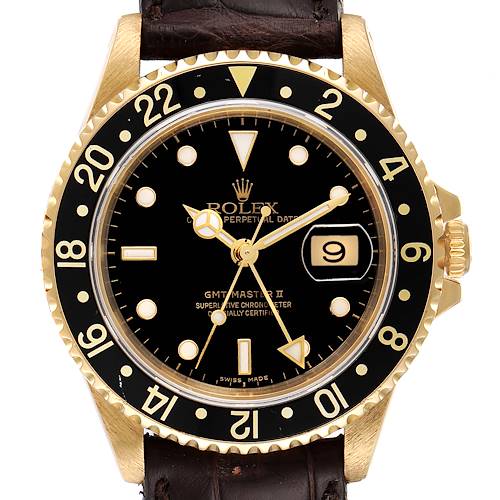 This image shows a front view of the Rolex GMT-Master 16718 Men's Yellow Gold Black Dial 16718 Men's Yellow Gold Black Dial watch, highlighting its black dial, date display, and bezel with a leather strap.