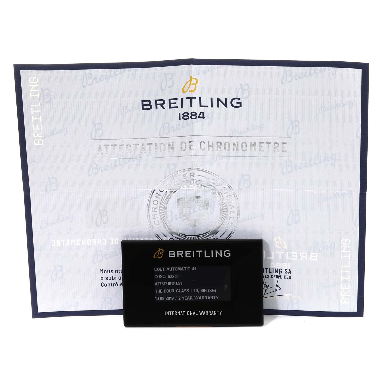 This image shows a certificate and international warranty card for a Breitling Colt A17313 Men's Stainless Steel White Dial A17313 Men's Stainless Steel White Dial model.