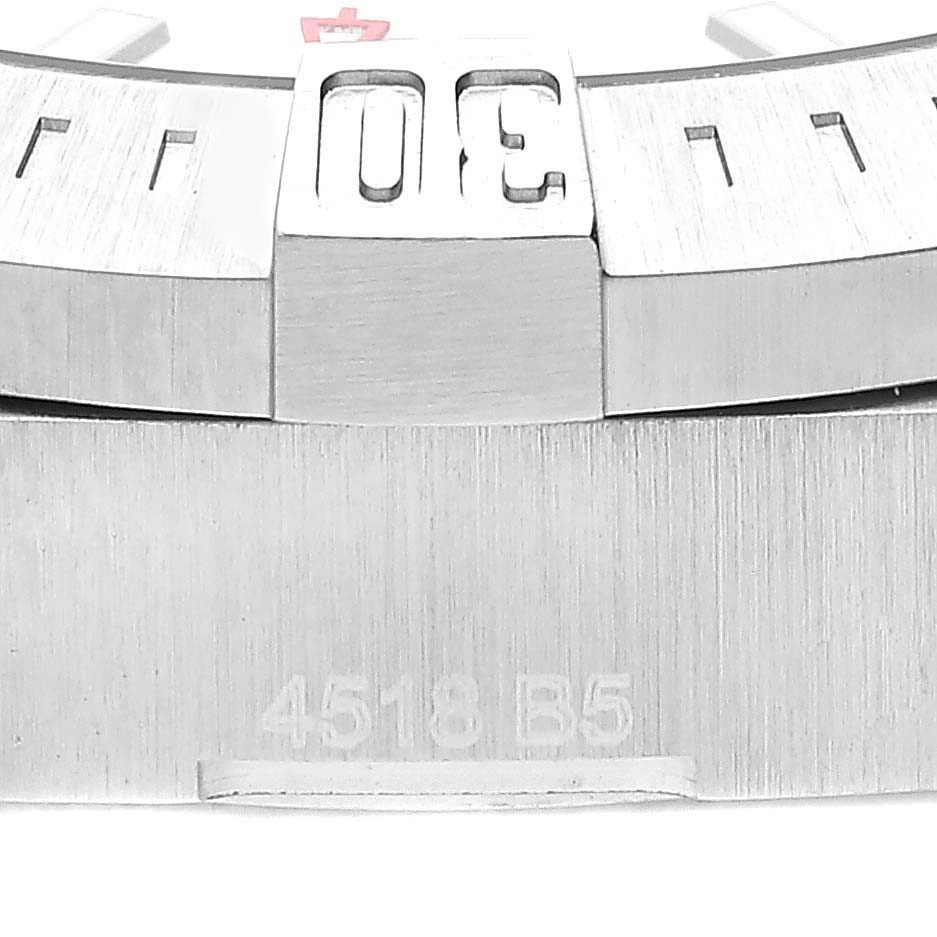 This image shows a close-up of the bezel and part of the case of a Breitling Colt A17313 Men's Stainless Steel White Dial A17313 Men's Stainless Steel White Dial watch.